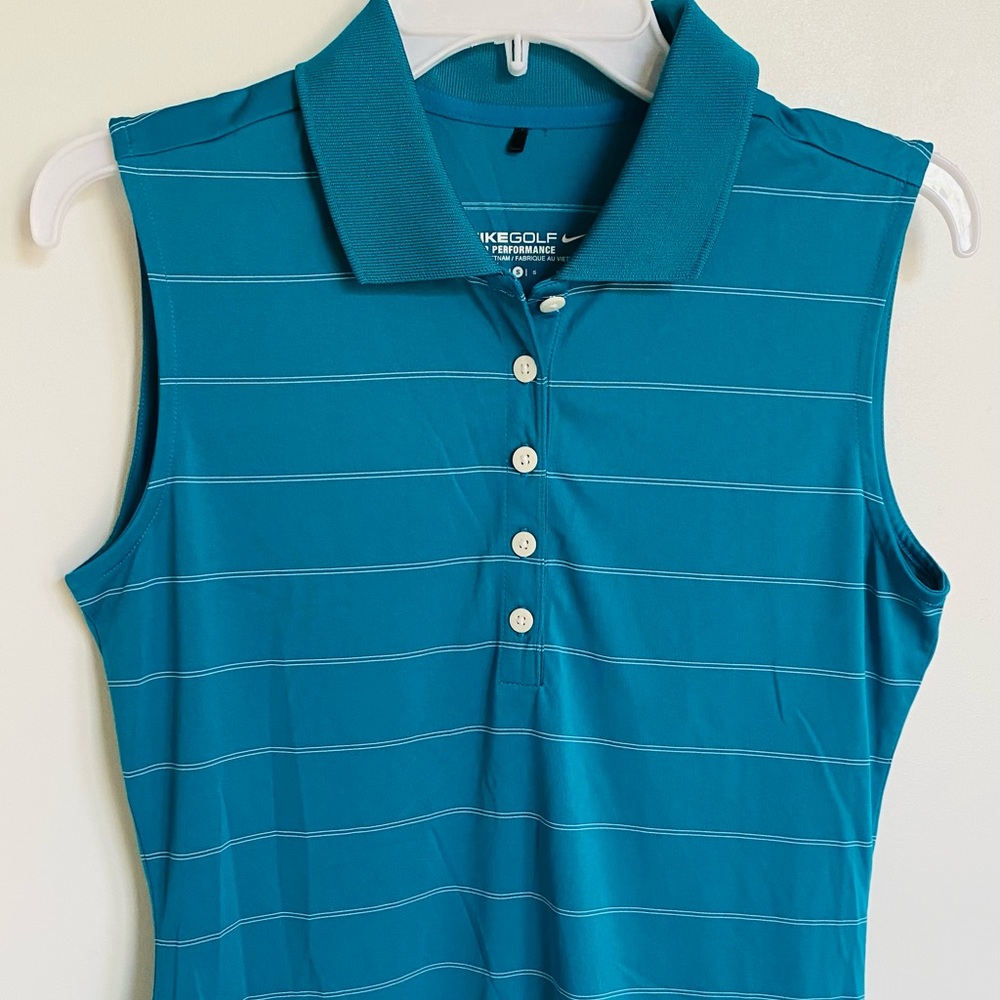 Nike Golf polo top - Size small, Indigo blue top with thin white lines accents.